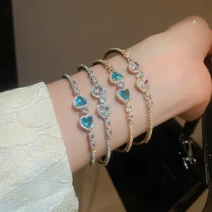 Luxurious gold and silver heart bracelets with blue zircon and sparkling crystals