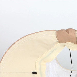 Close-up of beige sun hat detail featuring breathable white mesh lining and knotted design