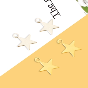 Golden and silver star metal pendants for DIY jewelry making on a split background