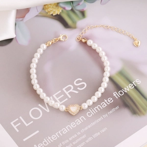 Elegant 18K gold heart charm pearl bracelet with sparkling zircon stones for women