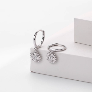 Elegant S925 sterling silver sunflower hoop earrings with brilliant zircon inlays on white stand