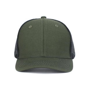 Close-up of a dark green trucker hat with breathable black mesh and curved brim detail
