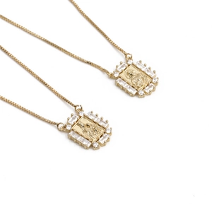 Gold pendant necklace with zircon-inlaid religious motif and square frame on a box chain