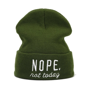 Dark green knitted beanie with white embroidered NOPE NOT TODAY text on white background