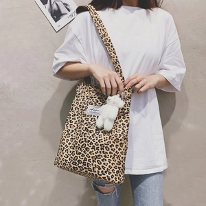 Leopard print canvas tote bag with shoulder straps and cute plush bear charm