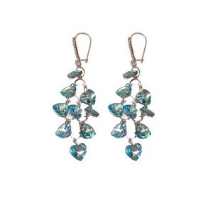 Elegant gold heart earrings with cascading blue iridescent crystals on white background