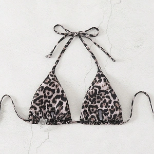 Detailed view of leopard print bikini top with lace-up halter neck and triangle cups