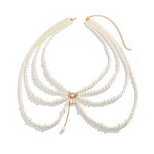 Detail of multi-layer pearl body chain with golden rings and waterdrop pearl pendants
