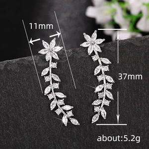 Sparkling silver flower drop earrings with leaf tassel and cubic zirconia crystals