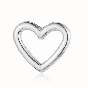 Macro view of a heart-shaped silver stainless steel pendant with hollow design