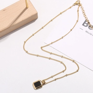 Minimalist square black pendant necklace in gold-plated titanium steel with a sleek cable chain