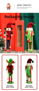 Detail of 30cm wooden Nutcracker figures with skiing theme and holiday gift packaging