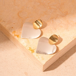 Minimalist geometric heart earrings with dual-tone gold and silver metallic contrast finish