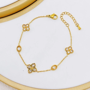 Gold stainless steel flower and oval zircon bracelet with five charms and adjustable chain