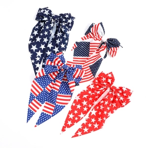 Set of four USA flag bow hair clips with stars and stripes streamers for Independence Day