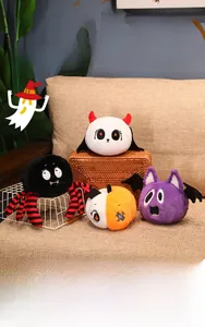 Close-up of Halloween plush toys set including spider and pumpkin on a woven basket