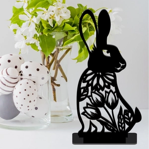 Detailed close-up of a black hollow rabbit silhouette decoration for Easter tabletop display