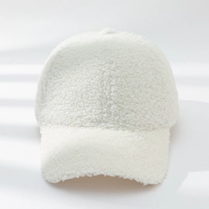 Detailed close-up showing the soft white lamb wool texture of the winter baseball cap
