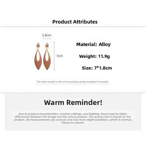 Detailed view of brown hollow teardrop earrings with alloy material and silver needle