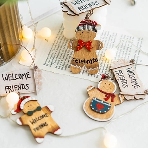 Wooden Christmas Gingerbread Man Welcome sign with red bow and warm festive lights