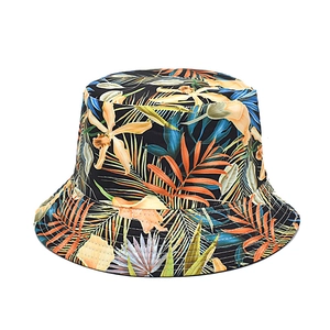 Double-sided reversible bucket hat with tropical leaf print for outdoor sun protection