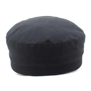 Detail view of the black cotton twill flat top navy cap from a 45-degree back angle