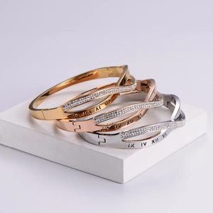 Three-tone roman numeral bangles in gold, rose gold and silver with cubic zirconia