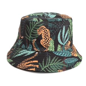 Close-up of tropical leopard and palm leaf print on durable black canvas bucket hat
