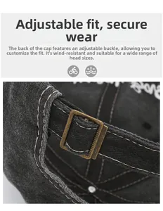 Detail of adjustable metal buckle on washed black baseball cap with embroidery