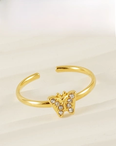 Macro shot of 18k gold plated stainless steel butterfly ring with zircon pavé details