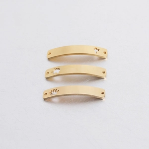 Close-up of gold hollow tree elephant and crown curved bar connector charms
