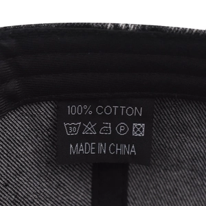 Detail of 100% cotton washing label and inner twill texture of the vintage baseball cap