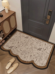 Detail of vintage floral PVC floor mat with scalloped edges at a modern home entrance