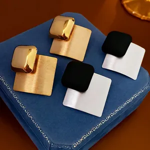 Minimalist brushed metal geometric square stud earrings in gold and silver finish