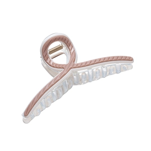 Transparent shark hair claw clip with pink-brown striped edges on white background