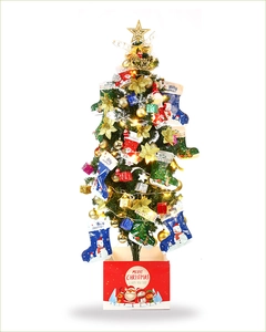 Mini Christmas tree with LED lights and stocking ornaments on a red gift box base