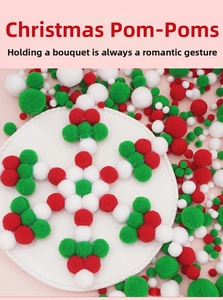 Detailed view of red, green, and white fluffy pom poms arranged in a festive pattern
