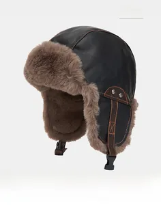 Detail of black PU leather aviator hat with warm brown plush lining and side buckle strap