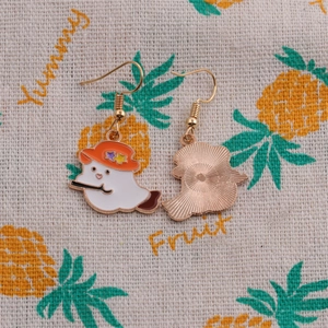 Detailed front and back view of ghost earrings with hat and cane in colorful enamel
