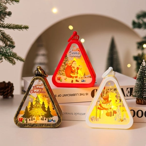 Three vintage Christmas lanterns with LED lights featuring Santa and snowman illustrations