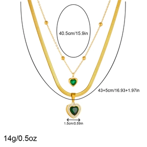 Double-layered gold necklace with green heart emerald pendants and white diamond accents