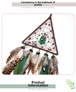 Detail of bohemian triangle dream catcher with brown beads and green natural feathers