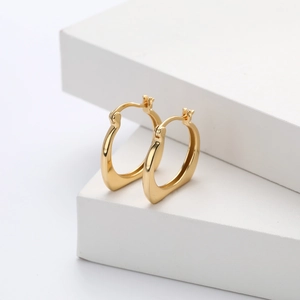 Boucles d'oreilles créoles géométriques en argent S925 avec finition dorée chic