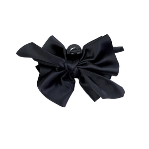 Elegant black satin bow hair claw clip with a glossy finish for French retro styling