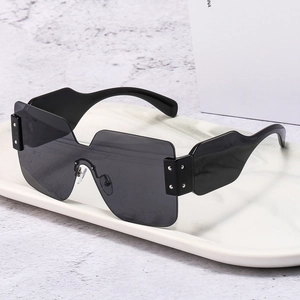 Fashion oversized one-piece wrap shield sunglasses with broad temples on marble tray