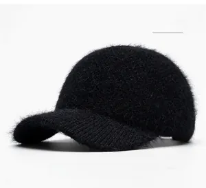 Close-up detail of plush black faux mink fur texture on a winter baseball cap