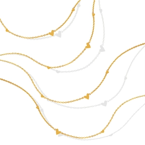 Minimalist gold-plated titanium steel necklace with small heart charms on a white background