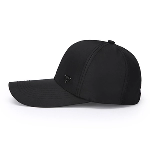 Classic black baseball cap with long brim and silver triangle metal badge on side profile