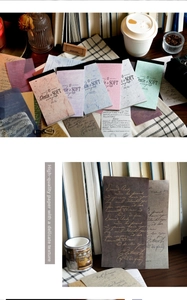 Detail of vintage Morandi scrapbooking paper with natural fiber texture and script