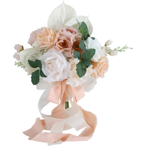 Bridal wedding bouquet with white and champagne roses, calla lilies and long ribbons